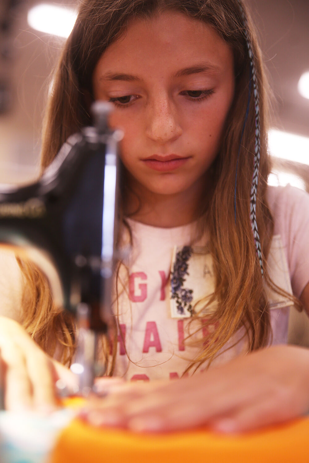 Abrie Hein works on finishing the final seems of her quilt